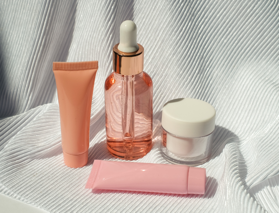 Serum Bottle, Cosmetic Tubes and Container on White Fabric @Danah Pascual via Corelens